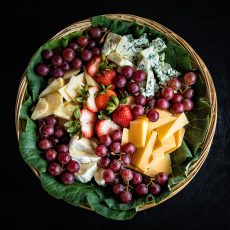 Cheese and fruit in a basket