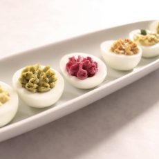 Deviled eggs on a long white tray